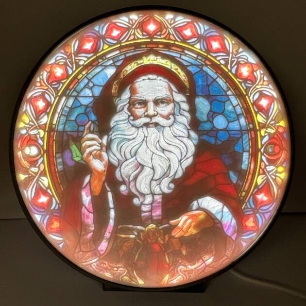 Ornate Santa Claus lithophane with vibrant stained glass-style design, illuminated from behind.